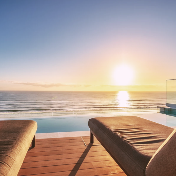 Architectural pool design with laminated structural glass panel on the Gold Coast