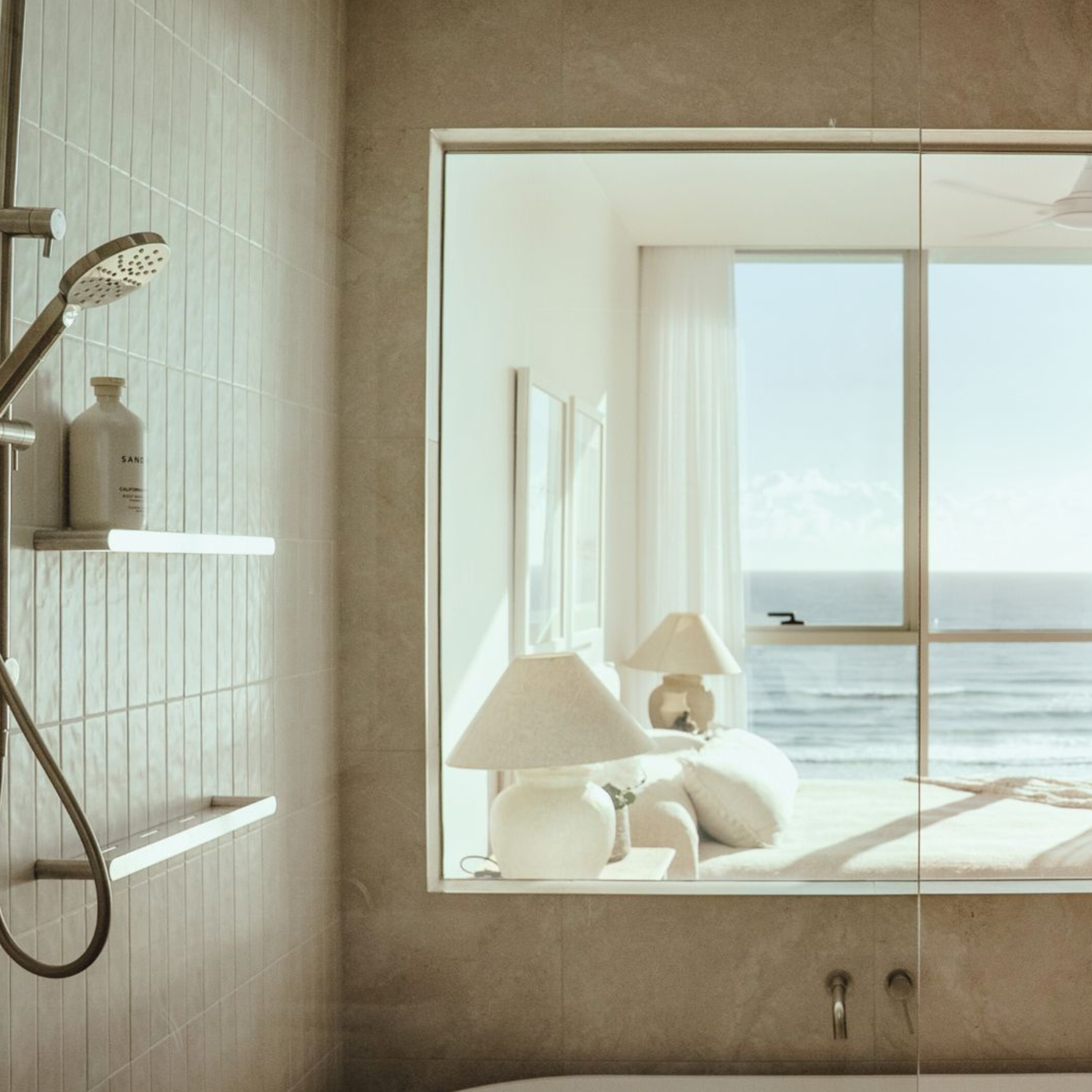 Fixed 9.92mm clear switchable laminated glass panel between bathroom and bedroom in Palm Beach apartment