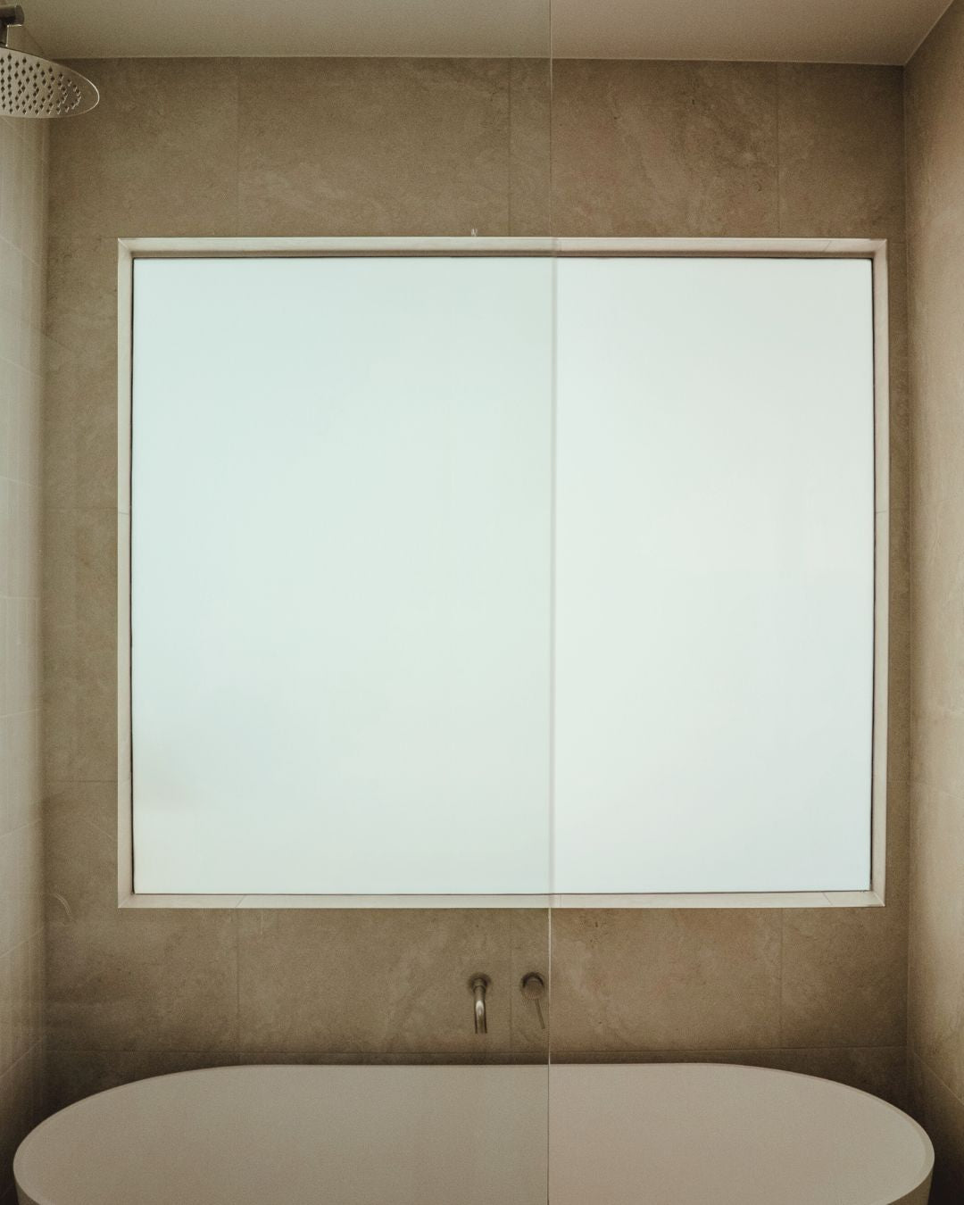 Switchable privacy glass in a bathroom turned off