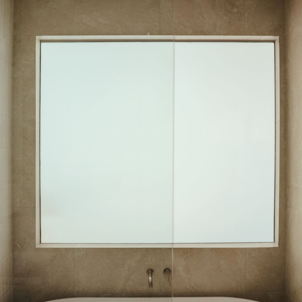 Switchable privacy glass panel allowing natural light flow in modern Gold Coast apartment