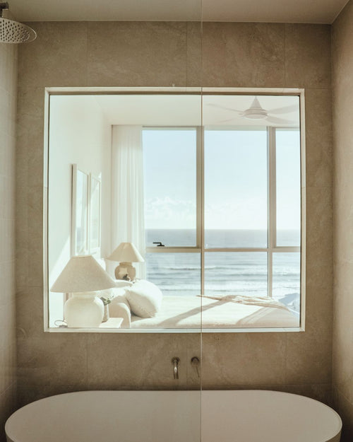 Switchable privacy glass in a bathroom turned on