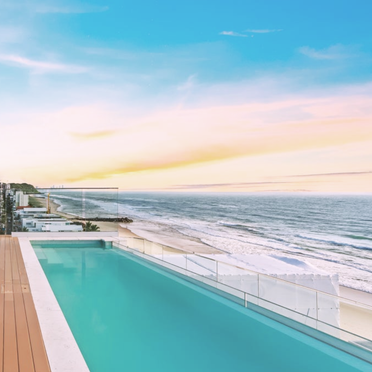 Structural laminated glass pool window overlooking a luxury Gold Coast residence