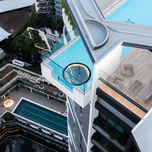 multi-layer laminated glass panel revealing the clarity of low-iron toughened glass above the pool below.