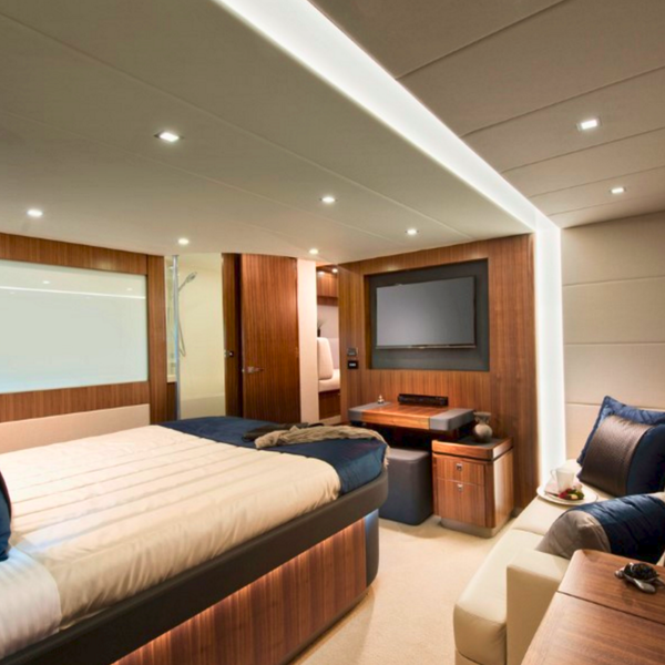 Curved and sleek switchable laminated glass partition in a Riviera yacht, showcasing luxury yacht smart glass applications and modern interior design solutions.