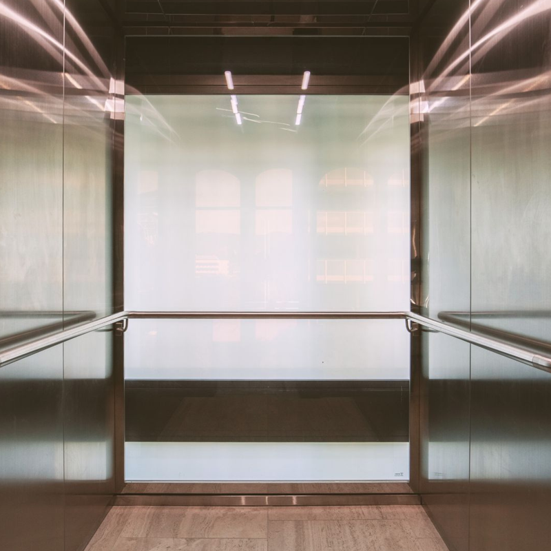 Switch glass turned off in lift shaft in residential home ont he Gold Coast with smart glass technology. 