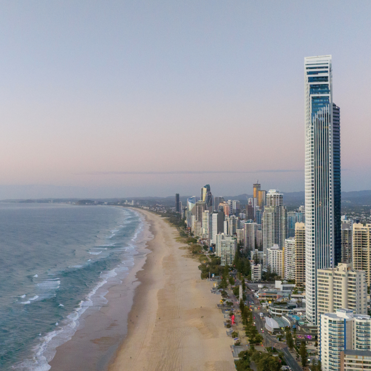 architectural ceramic-printed glass roof panels above a shopping walkway, illustrating commercial laminated safety glass, contemporary design, and weather-resistant glazing solutions.