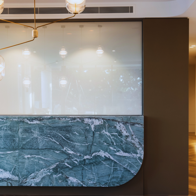 Switchable smart glass turned off in frosted between living room and dining room in Gold Coast home