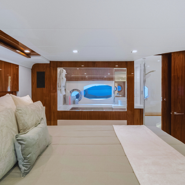 Clear-to-opaque laminated 9.92 mm switchable glass in a Riviera yacht stateroom, showcasing modern smart glass technology for high-end marine interiors.