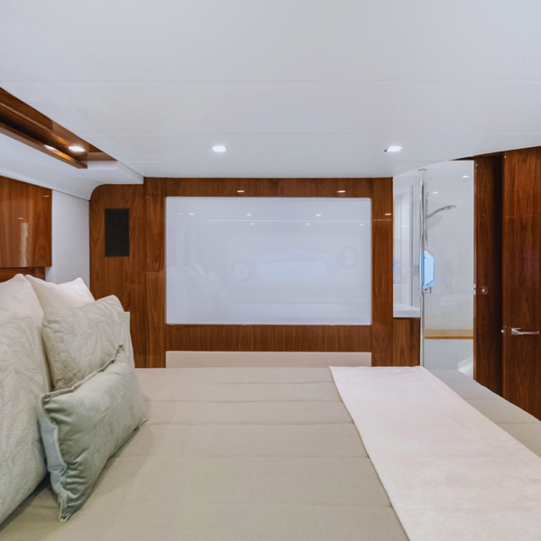 Fixed switchable glass panel in a luxury superyacht, highlighting privacy glass solutions and elegant interior design for bedroom-to-bathroom separation.
