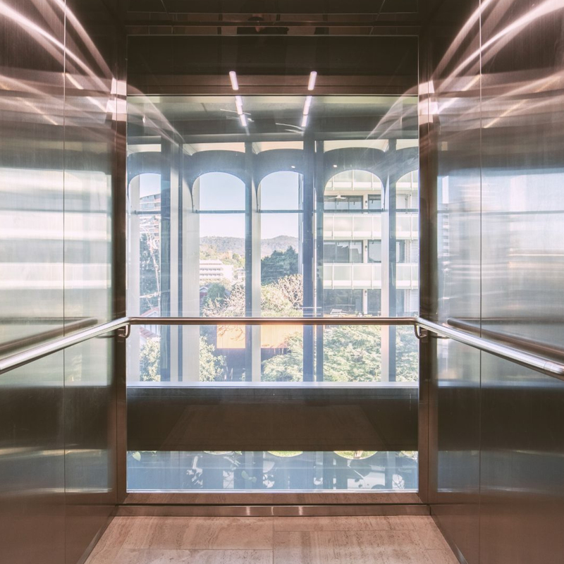 Lift shaft with switchable glass turned on clear using smart glass technology