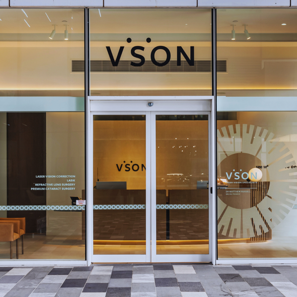 Automated smart glass door made from grey toughened switchable laminated glass, designed for medical consultation rooms requiring privacy, safety, and clean architectural lines.